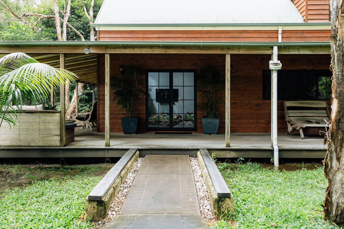 The retreat villa, framed by palms